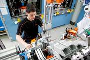 STIHL employee fits the new chainsaw MS 261 C-M with full electronic engine management M-tronic at assembly line in Waiblingen