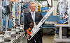 Chairman of the Executive Board, Dr. Bertram Kandziora with the new STIHL chainsaw MS 661 C-M at the assembly line in Waiblingen. The saw will be used as stock saw at the STIHL TIMBERSPORTS world championship.