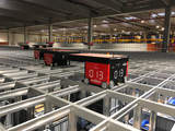 At STIHL Tirol's new automated small parts warehouse, 17 robots store 47,000 containers and stack them in aluminum shafts.