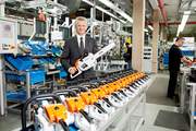 STIHL executive board chairman Dr. Bertram Kandziora presents the new STIHL chain saw MS 201 C-M at the production site in Waiblingen. The engine management system M-Tronic provides the exact fuel dosage for optimum engine power at all times.