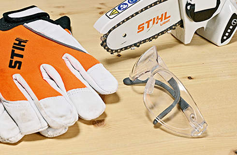 Safety glasses, gloves and the STIHL GTA 26 cordless garden pruner